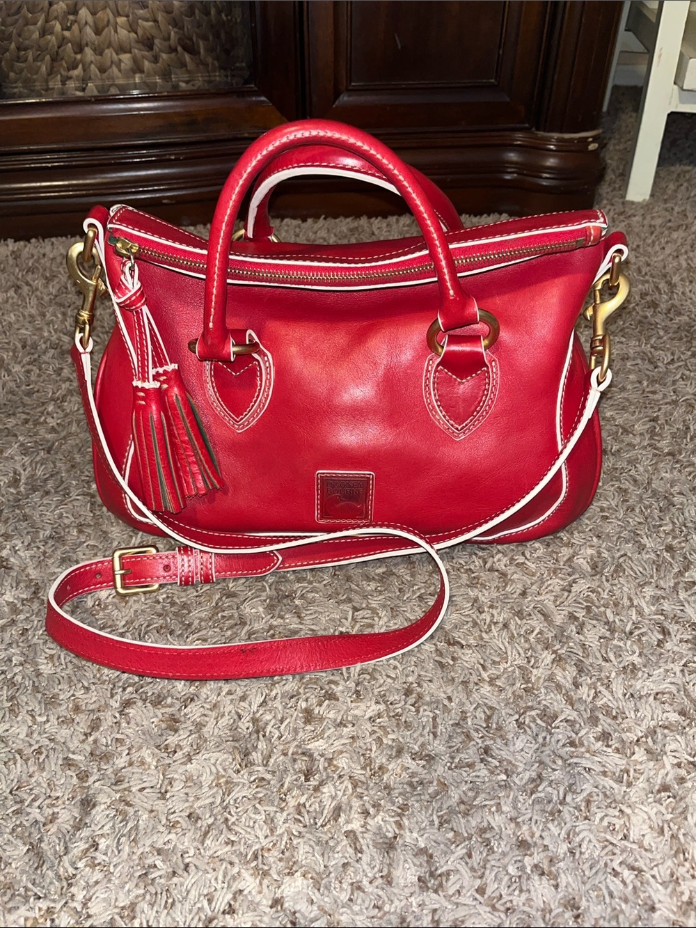 Red Florentine satchel with white piping